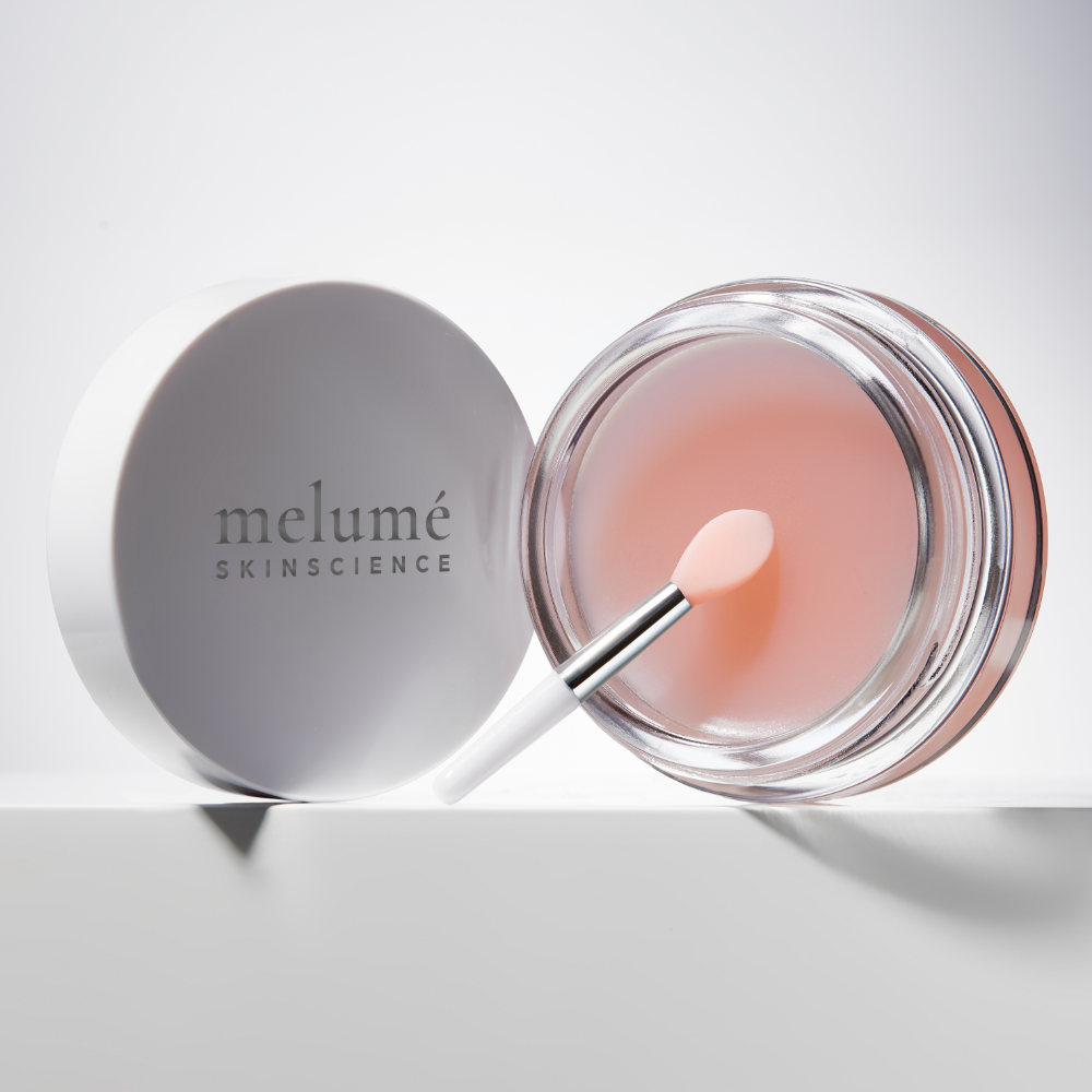 image mood of Melume Skinscience glossy lip line eraser from the front with applicator on grey flooring