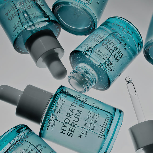 image of hydrating serums laying on white background