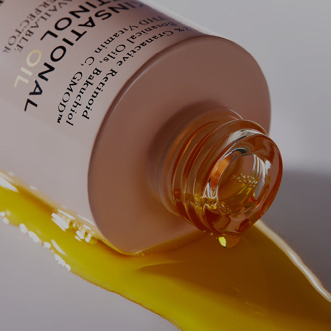 image of retinol oil close up and liquid running out
