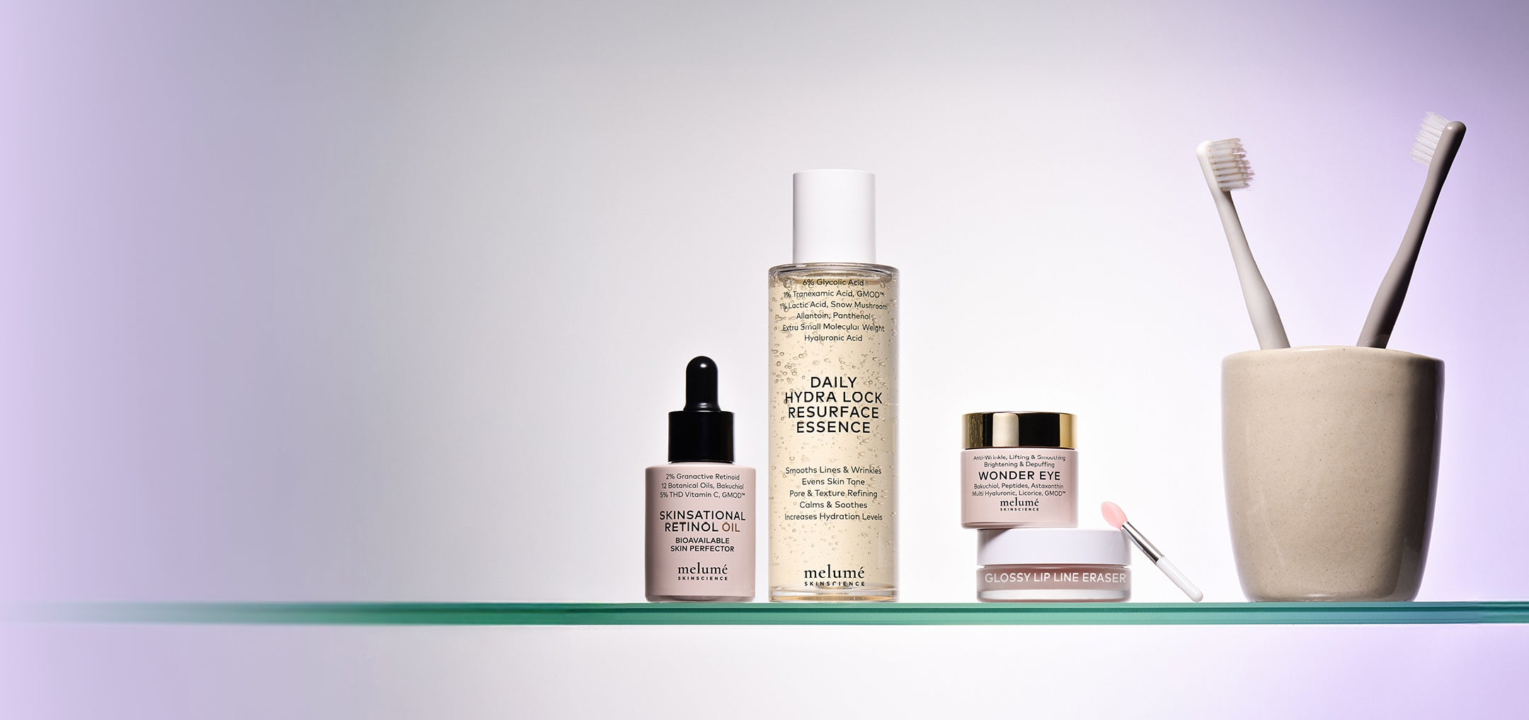 Skincare products behind purple background